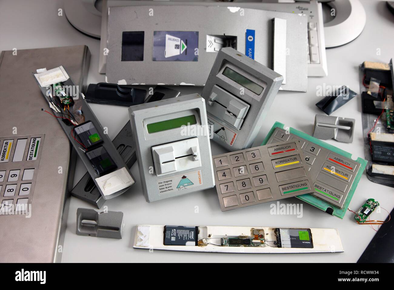 Seized equipment for skimming, tampering with ATMs, fake keyboards, card readers, cameras to record PINs, presented at a press Stock Photo