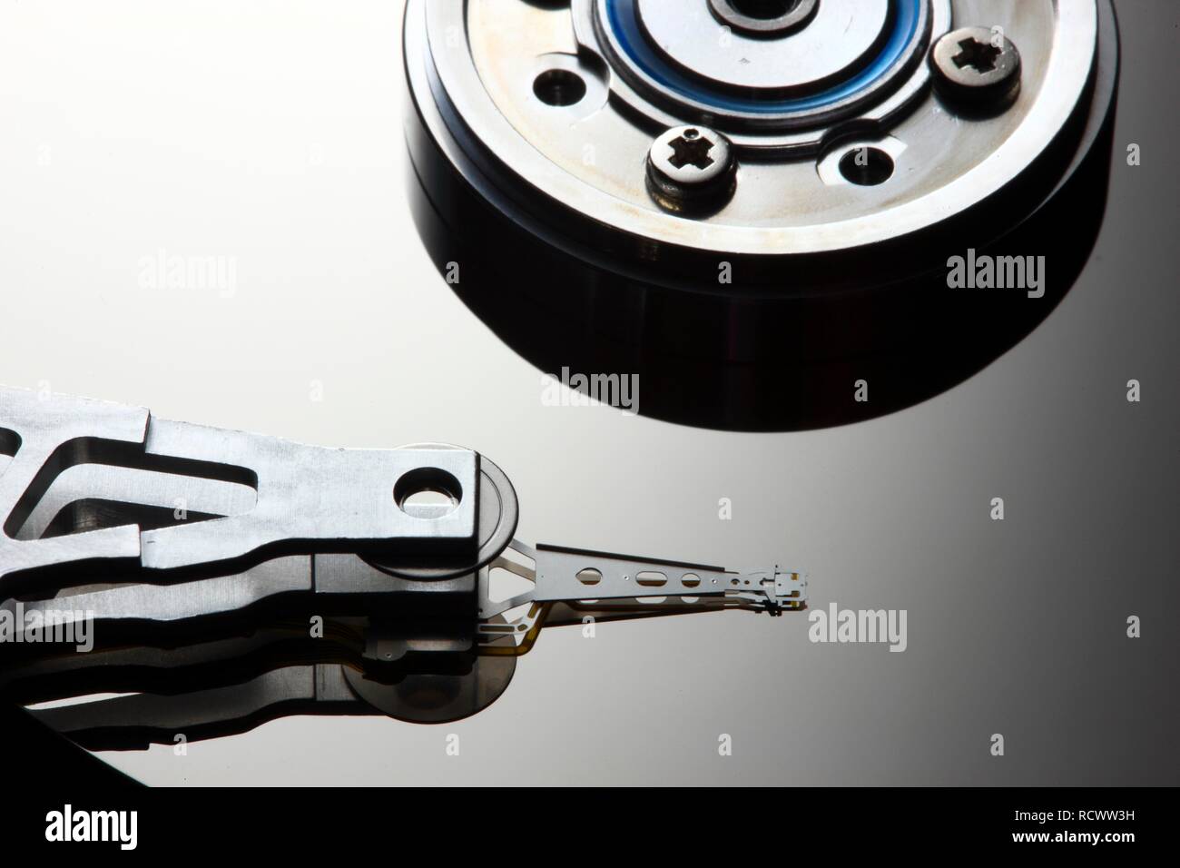 Computer hard drive, opened, read-write head on the disk Stock Photo