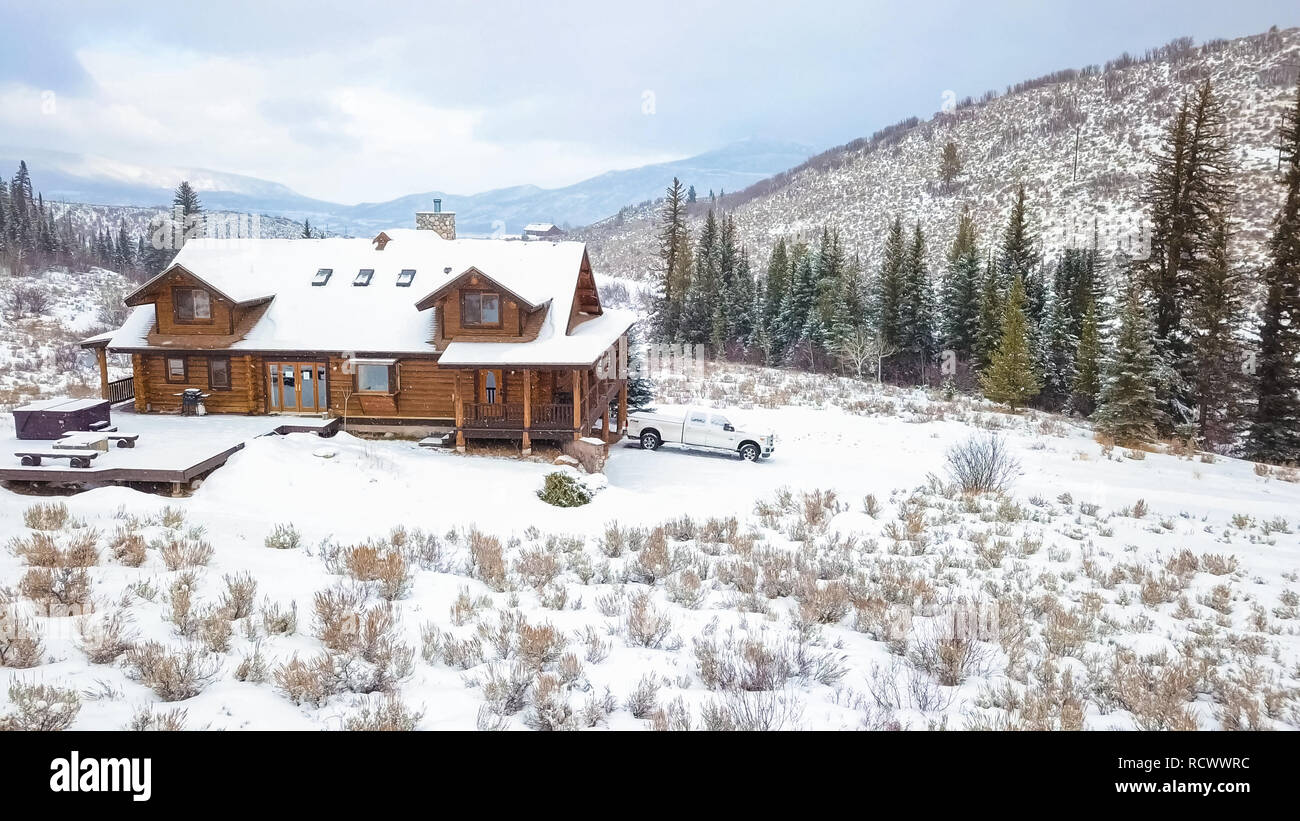 Aerial view of the mountain house covered in snow in the Winter Stock ...