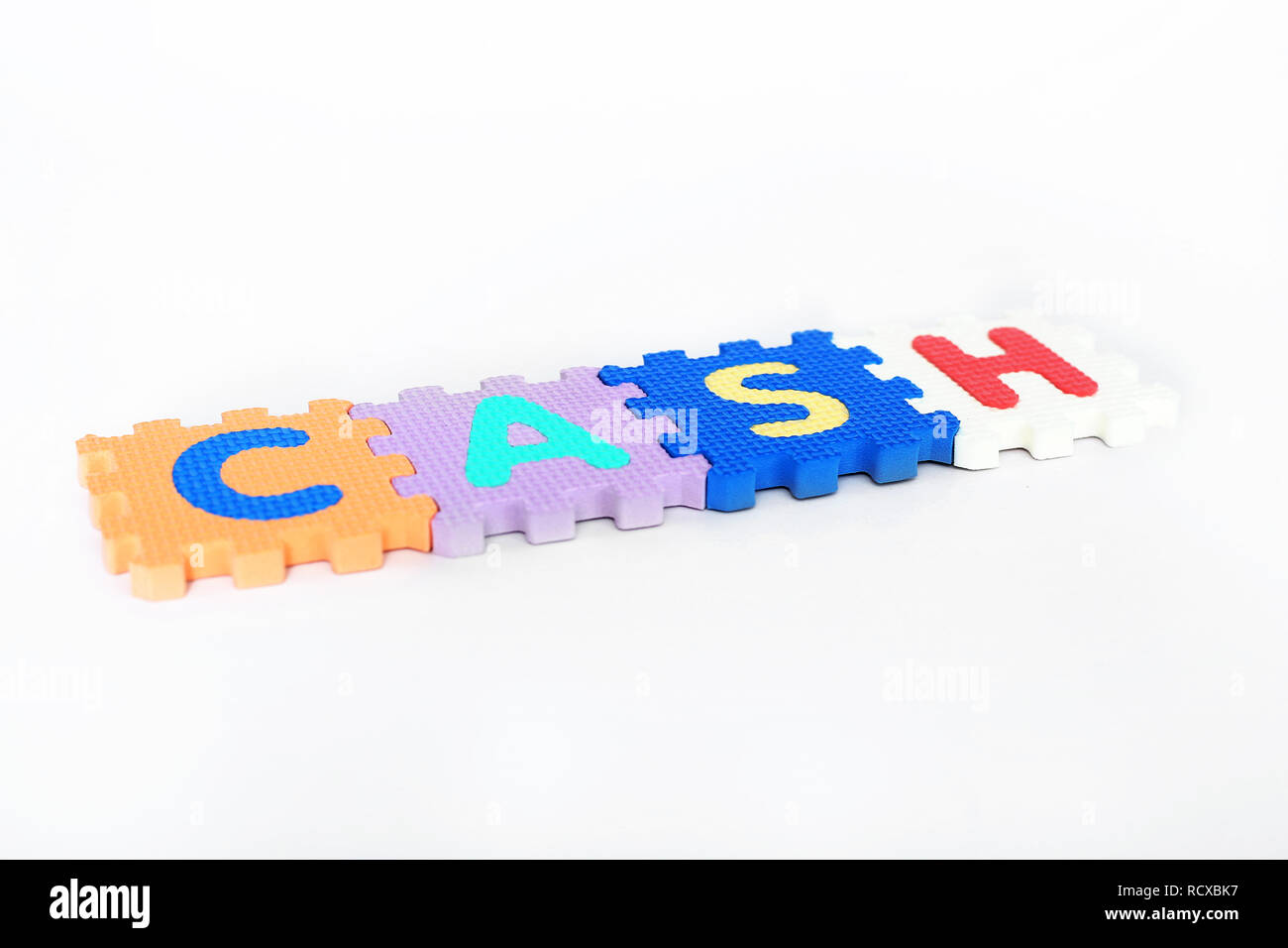 Cash word made colorful alphabets blocks. Isolated on the white