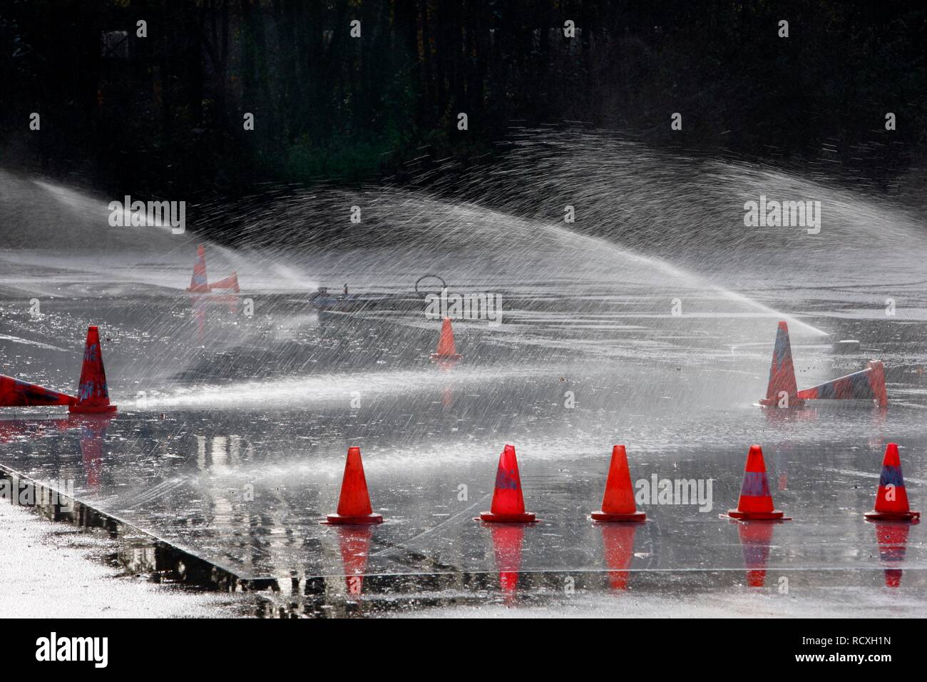 Artificial rainfall on a test route for drivers to test brakes on a wet surface, evasion movements and emergency stops Stock Photo