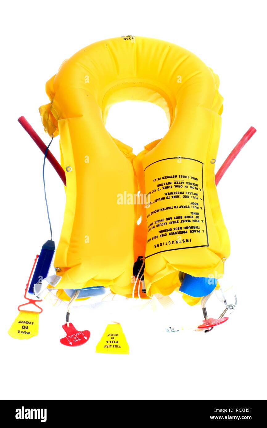 Life jacket from a plane, with air valves, two compressed air cartridges, a whistle and a signal light Stock Photo