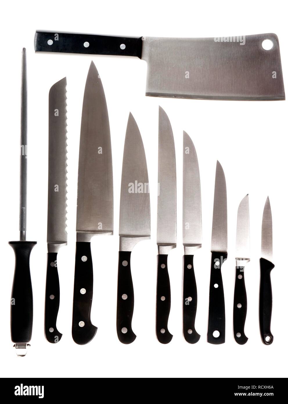 Various kitchen knives, sharpening steel, chef's knife, bread knife, filleting knife, vegetable knife and a cleaver Stock Photo