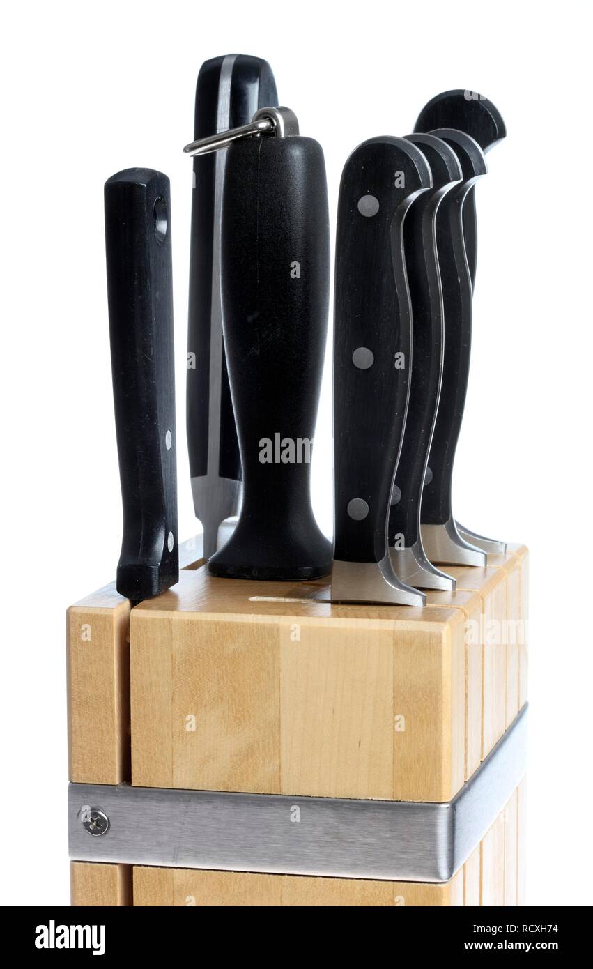 Wooden knife block with various kitchen knives Stock Photo