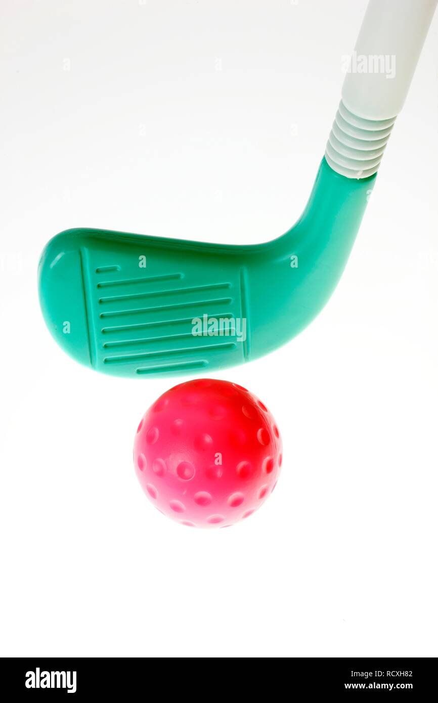 Toy plastic golf equipment, golf club and a golf ball Stock Photo Alamy