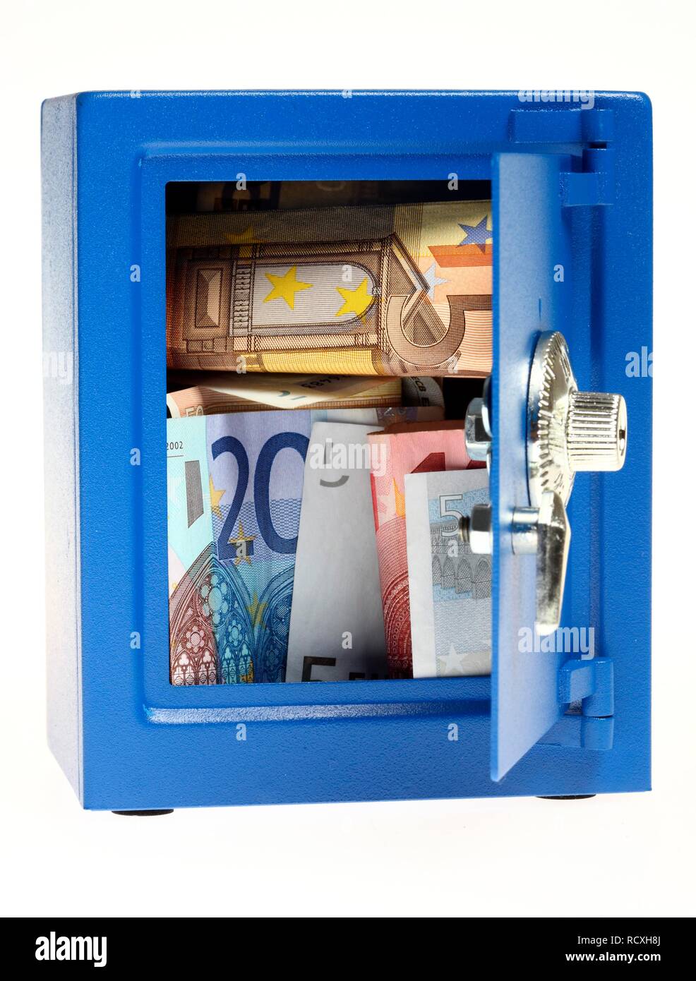 Small blue toy safe with a combination lock filled with euro banknotes, for use as a piggy bank Stock Photo