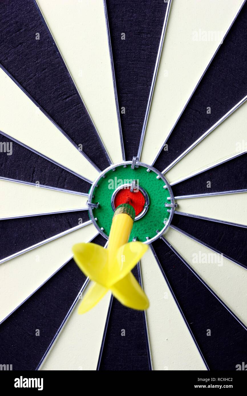 Darts, throwing game, dart sticking into the middle of the dartboard