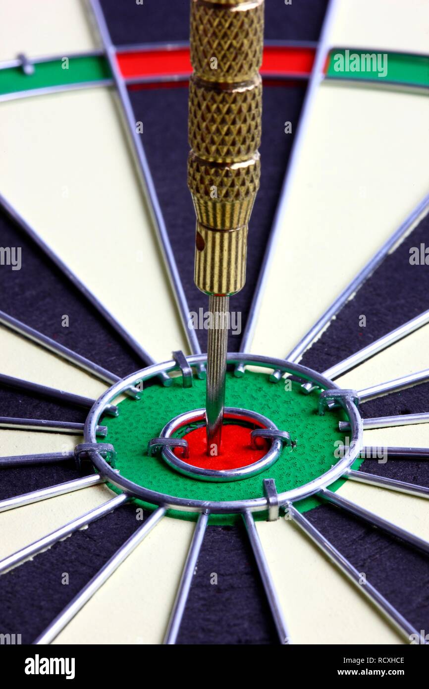 Darts, throwing game, dart sticking into the middle of the dartboard
