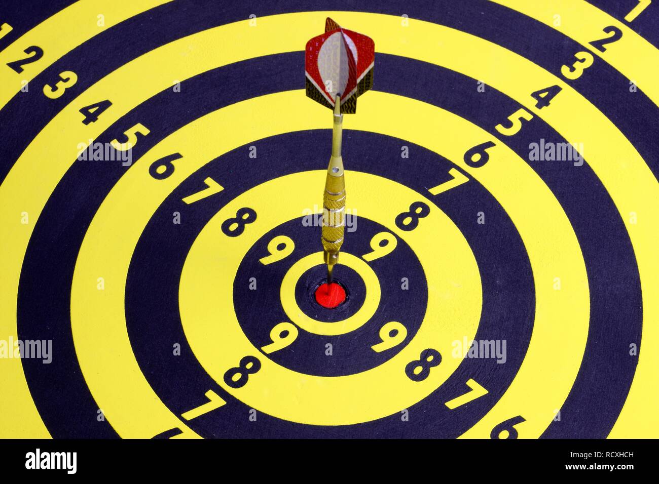 Darts, throwing game, dart sticking into the middle of the dartboard