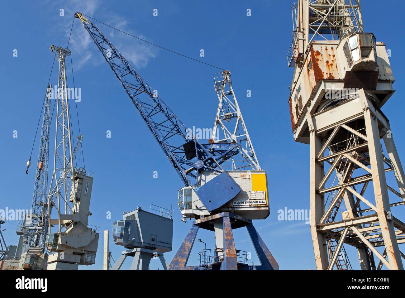 Old cranes at the harbour museum, Hamburg Wilhelmsburg Stock Photo