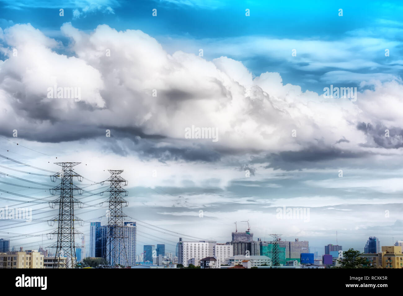 The blue cloudy sky and the high voltage Stock Photo - Alamy