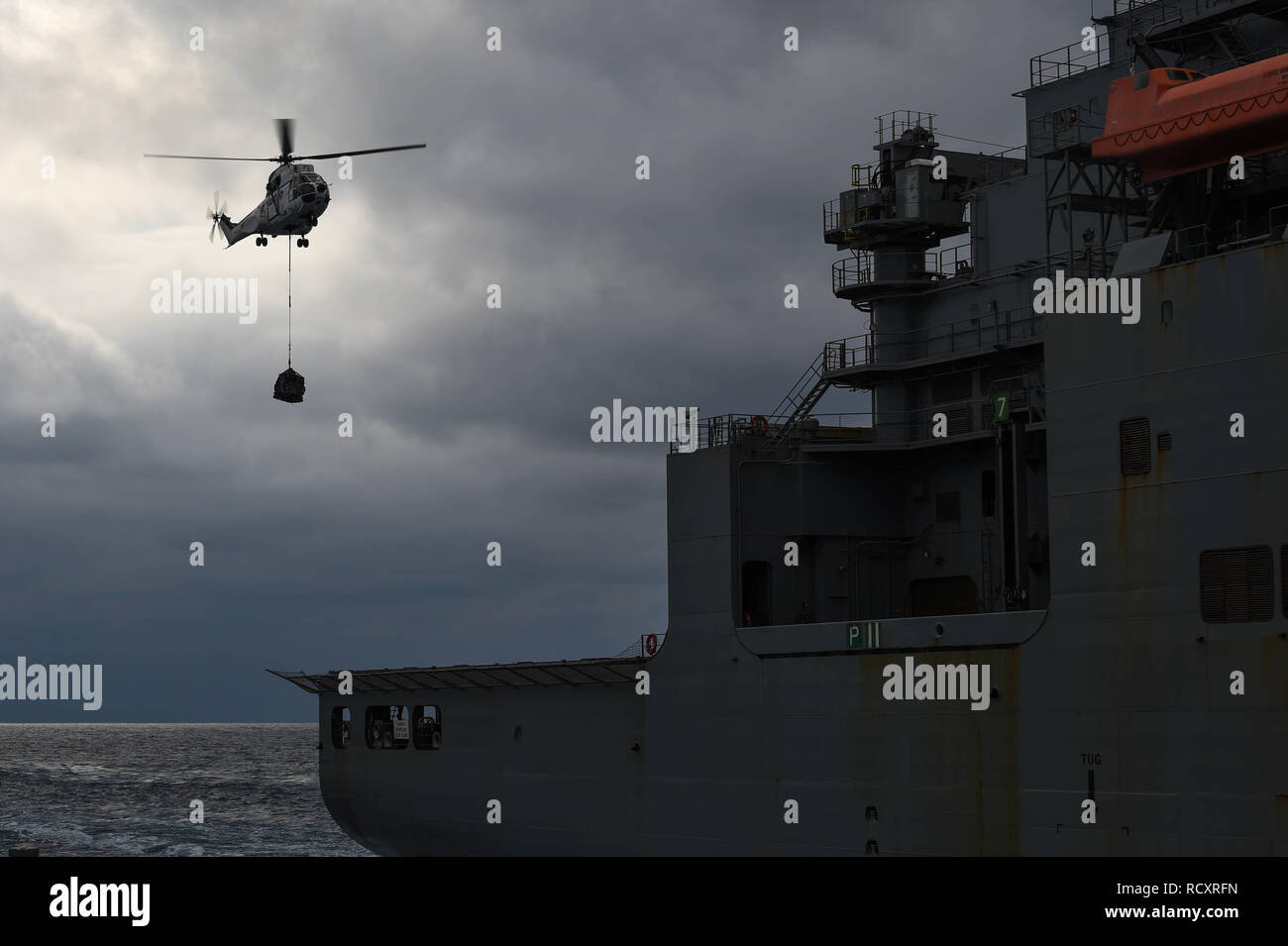 190111-N-VE240-3256 WATERS SOUTH OF JAPAN (Jan. 11, 2019) An SA 330 Puma conducts vertical replenishment drills aboard the dry cargo and ammunition ship USNS Wally Schirra (T-AKE 8) during a replenishment-at-sea with the Arleigh Burke-class guided-missile destroyer USS Milius (DDG 69). Milius is forward-deployed to the U.S. 7th Fleet area of operations in support of security and stability in the Indo-Pacific region. (U.S. Navy photo by Mass Communication Specialist 1st Class Rufus Hucks/Released) Stock Photo