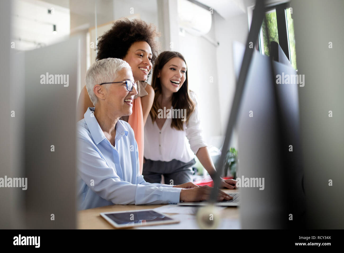Group of successful business people at work in office Stock Photo - Alamy