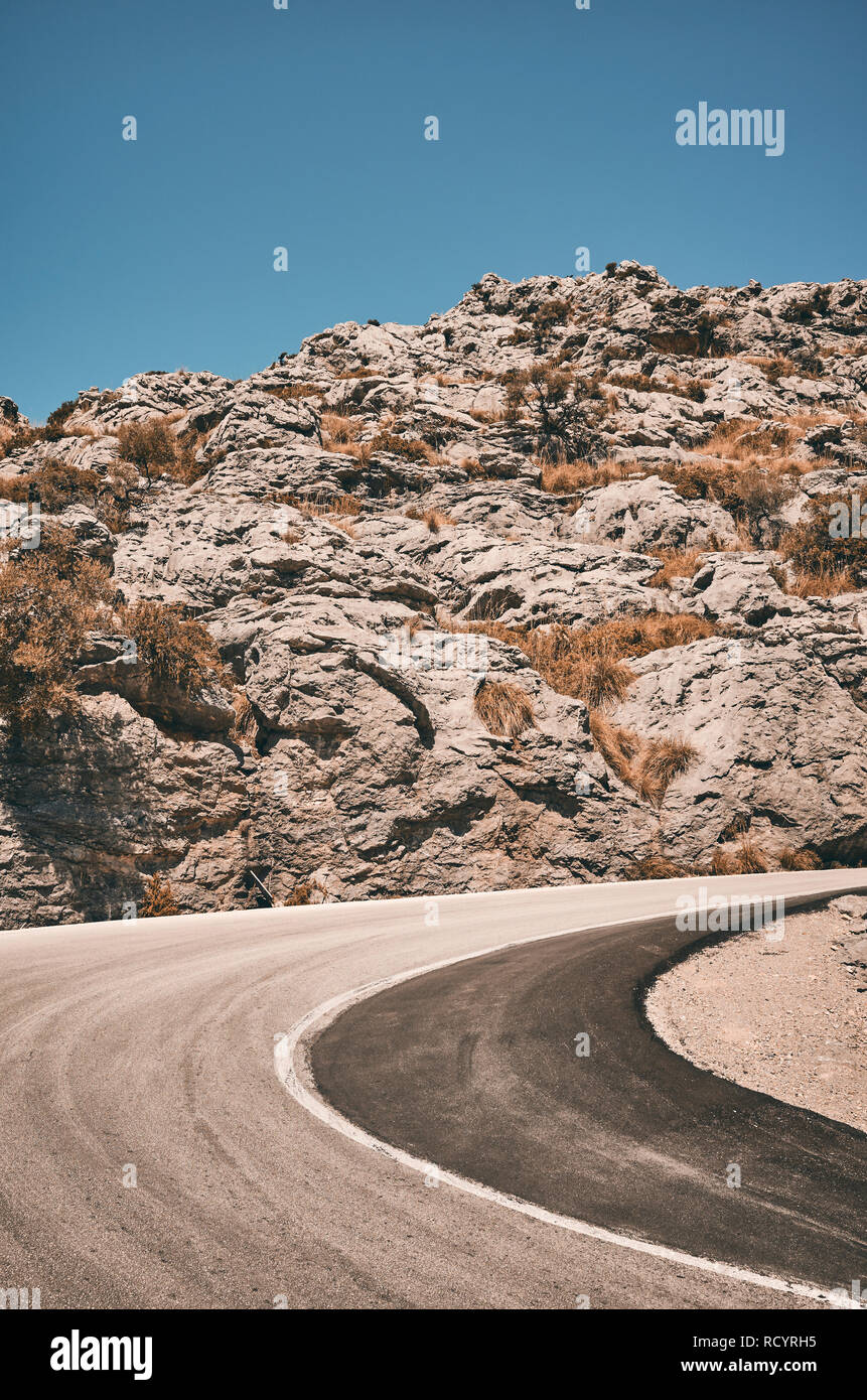 Mountain road curve, travel concept color toned picture. Stock Photo