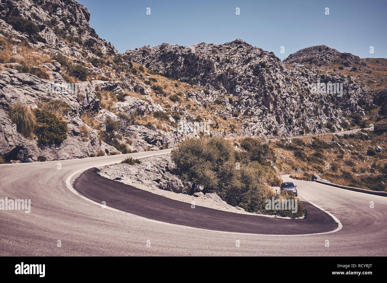 Mountain road curve, travel concept color toned picture. Stock Photo