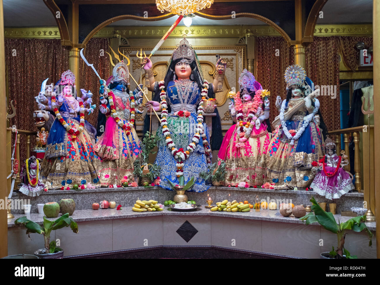 The altar at the Shri Shakti Mariammaa Hindu temple in Queens with several statues of deities. Stock Photo