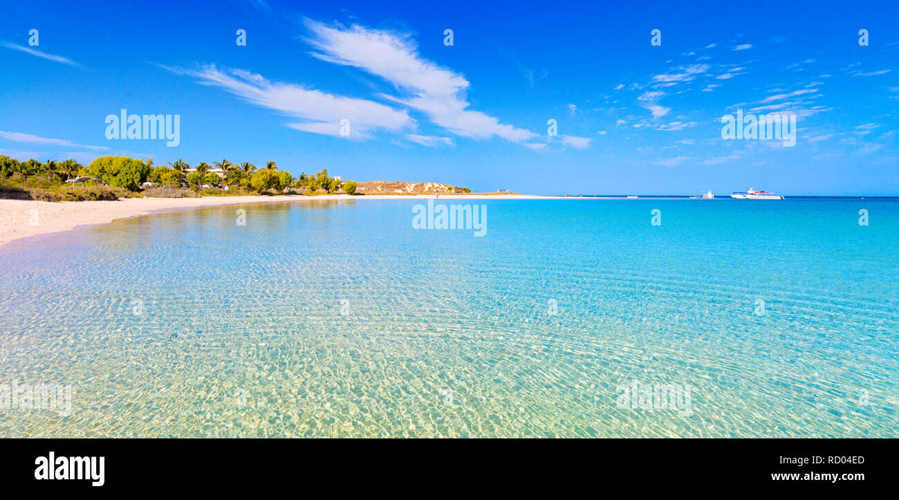 Australian beach in the Coral Coast region of WA. The beautiful, pristine beach and crystal clear water at Coral Bay, Western Australia. Stock Photo