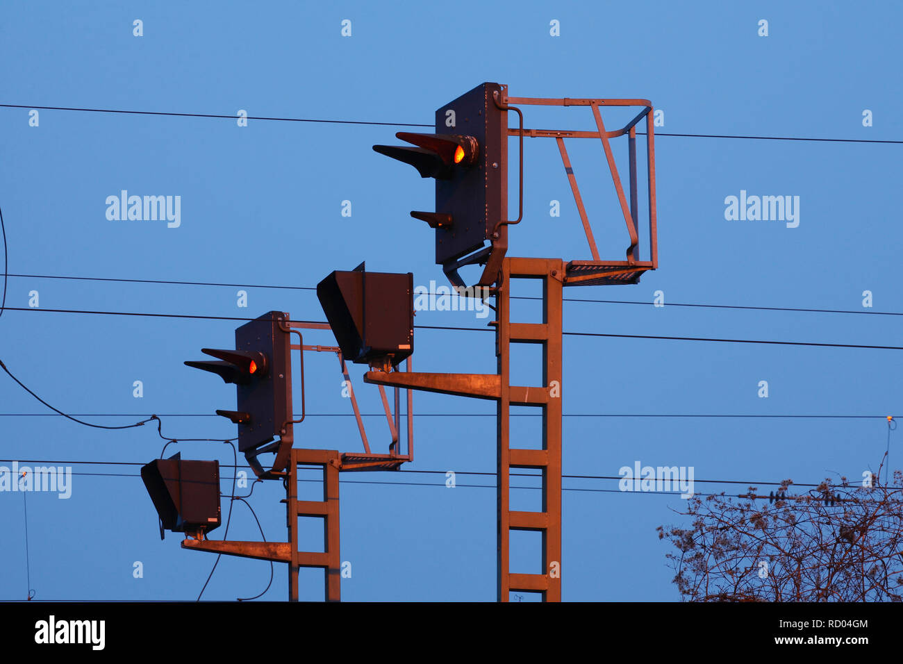 Signal masts of the railway at dusk, Germany I Signalmasten der Bahn bei Abenddämmerung, Deutschland Stock Photo