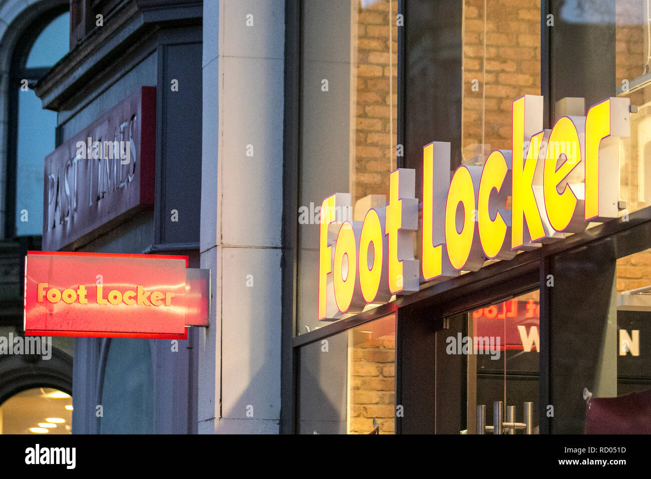 Footlocker illuminated shop signs in Preston City Centre, UK Stock