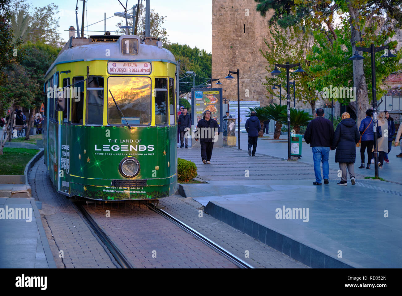 Antalya, Turkey : Historic tram on the street of Antalya, with sunset reflection in front window.  This is tram number 1 Stock Photo