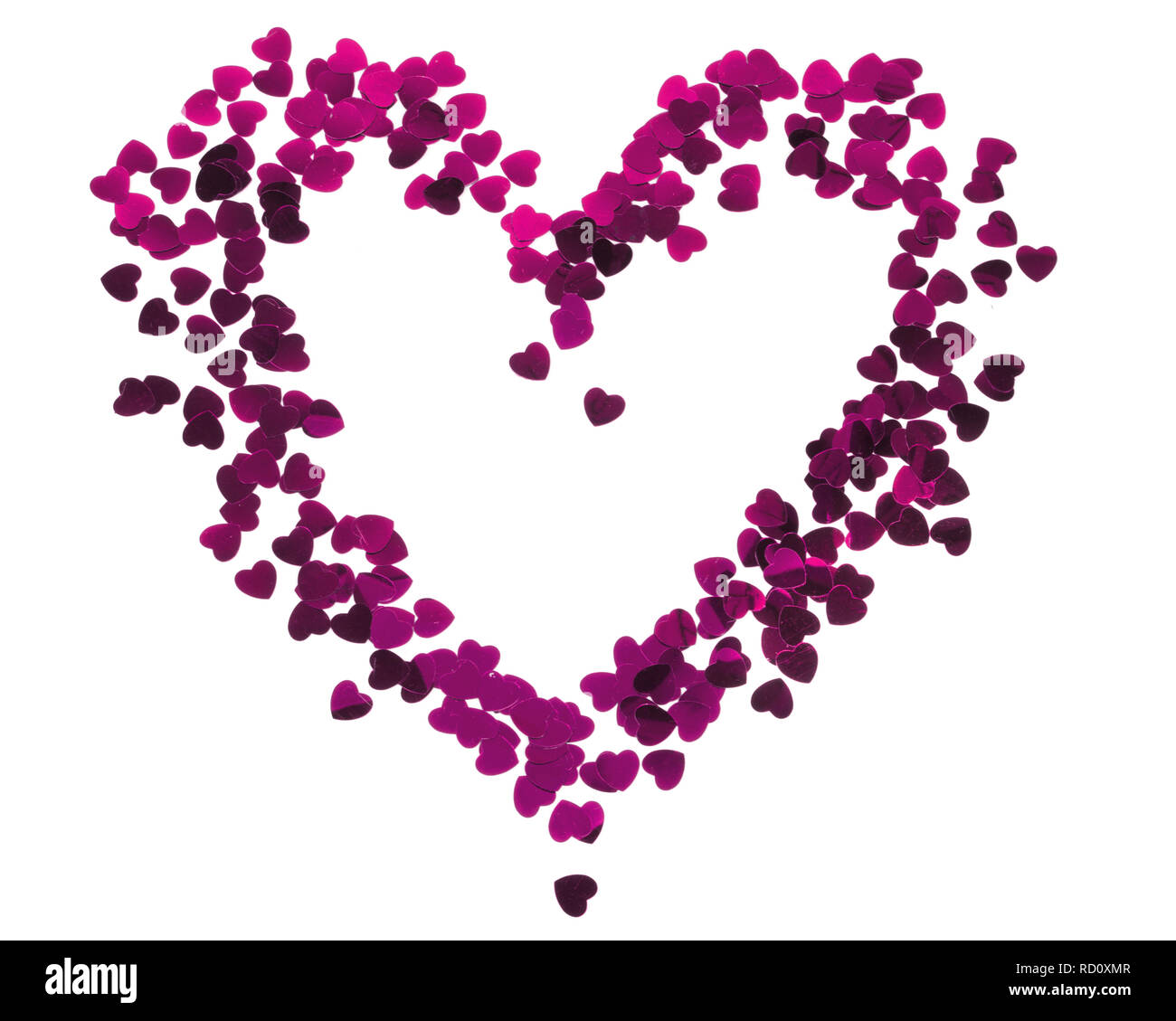 Heart silhouette made of red confetti. Valentines card Stock Photo