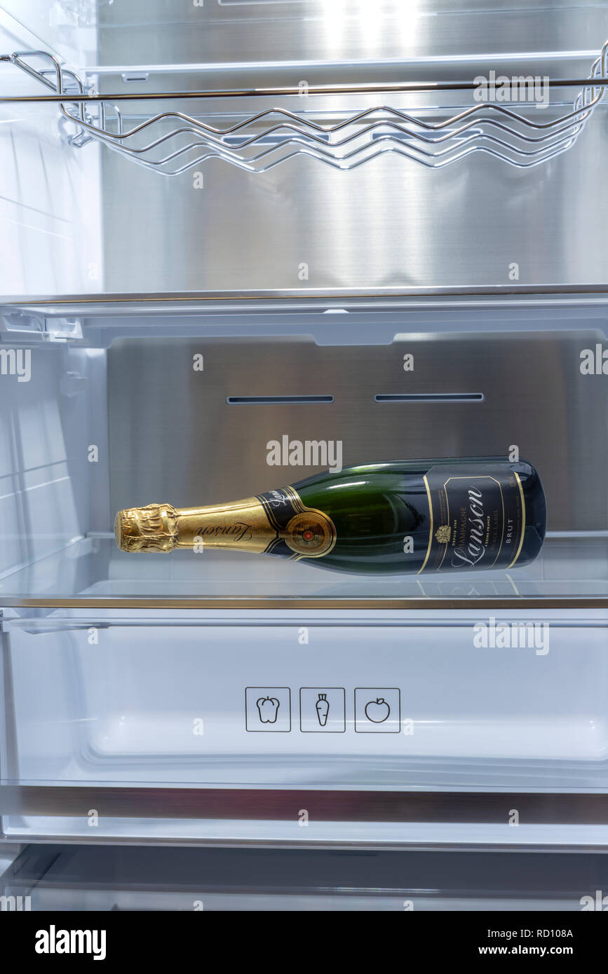 A bottle of Champagne wine in an otherwise empty fridge Stock Photo Alamy