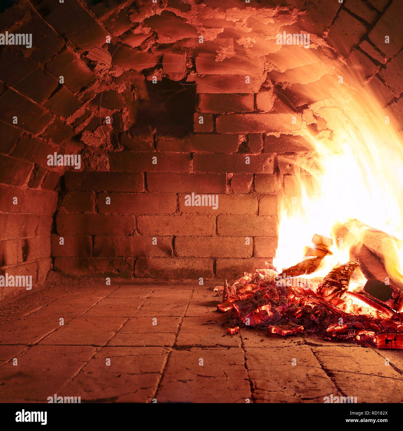 Fire wood burning in an old oven ready to cook Stock Photo