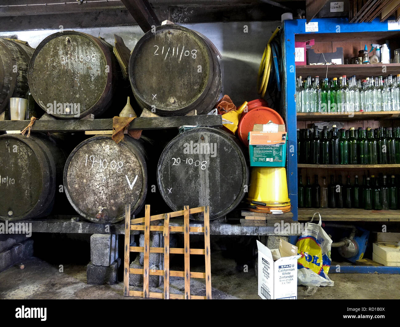 Cider barrels & bottles for apple juice on a farm, Aveton Gifford