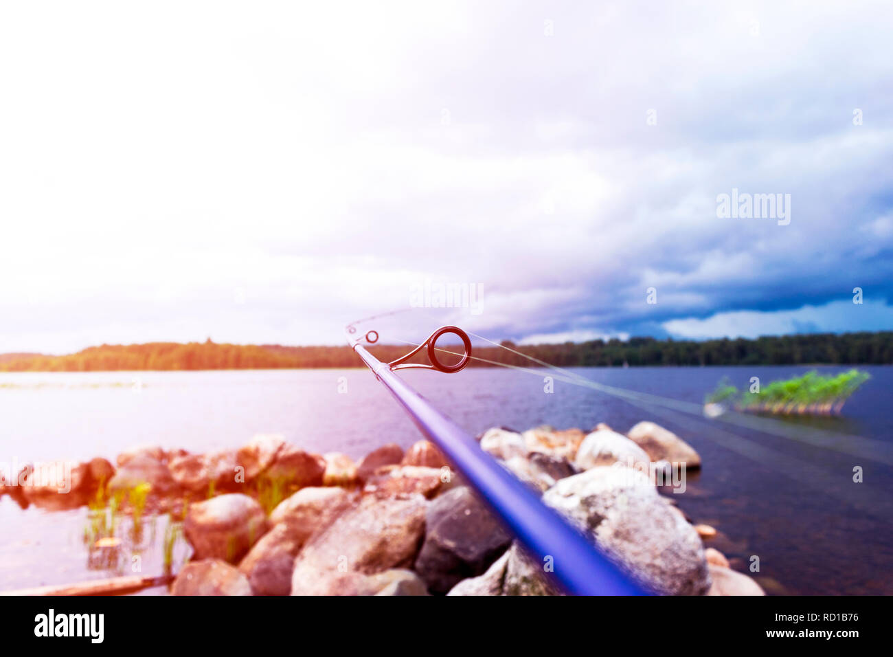 Fishing rod spinning ring with the line close-up. Fishing rod. Rod rings Selective focus and shallow Depth of field .Fishing tackle. Fishing spinning  Stock Photo