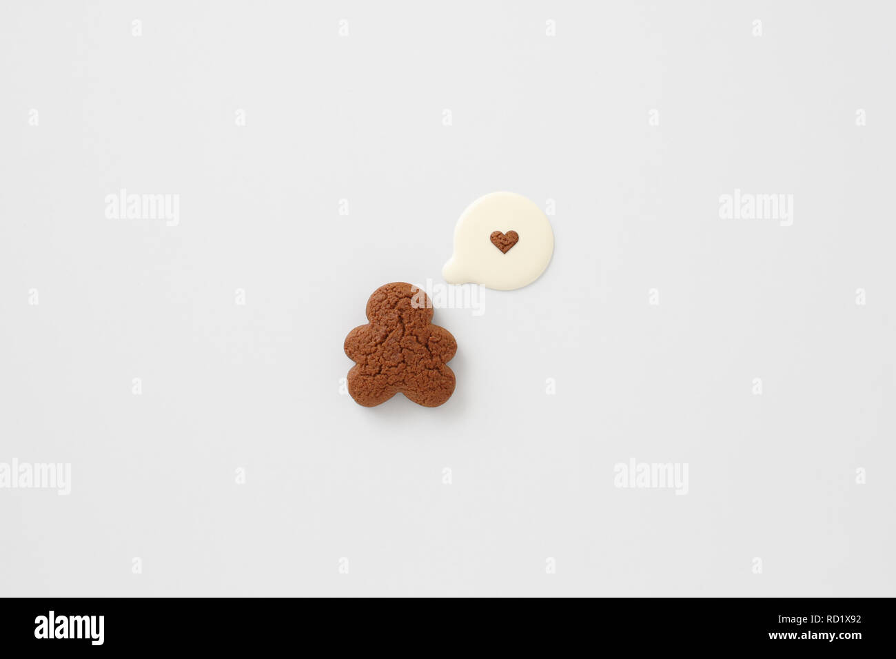 Gingerbread man & milk speech bubble love heart Stock Photo