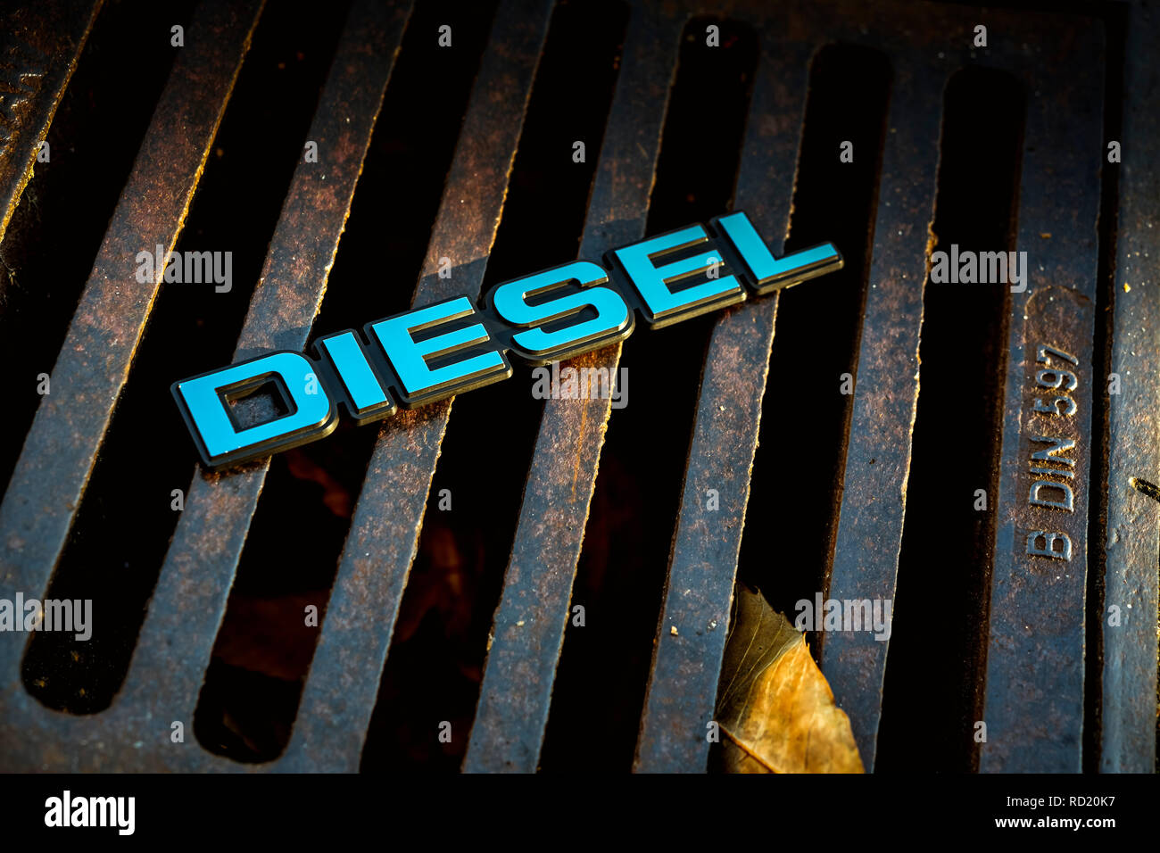 Diesel signs on a Gullideckel, end of the diesel car, Diesel-Zeichen auf einem Gullideckel, Ende des Diesel-Autos Stock Photo