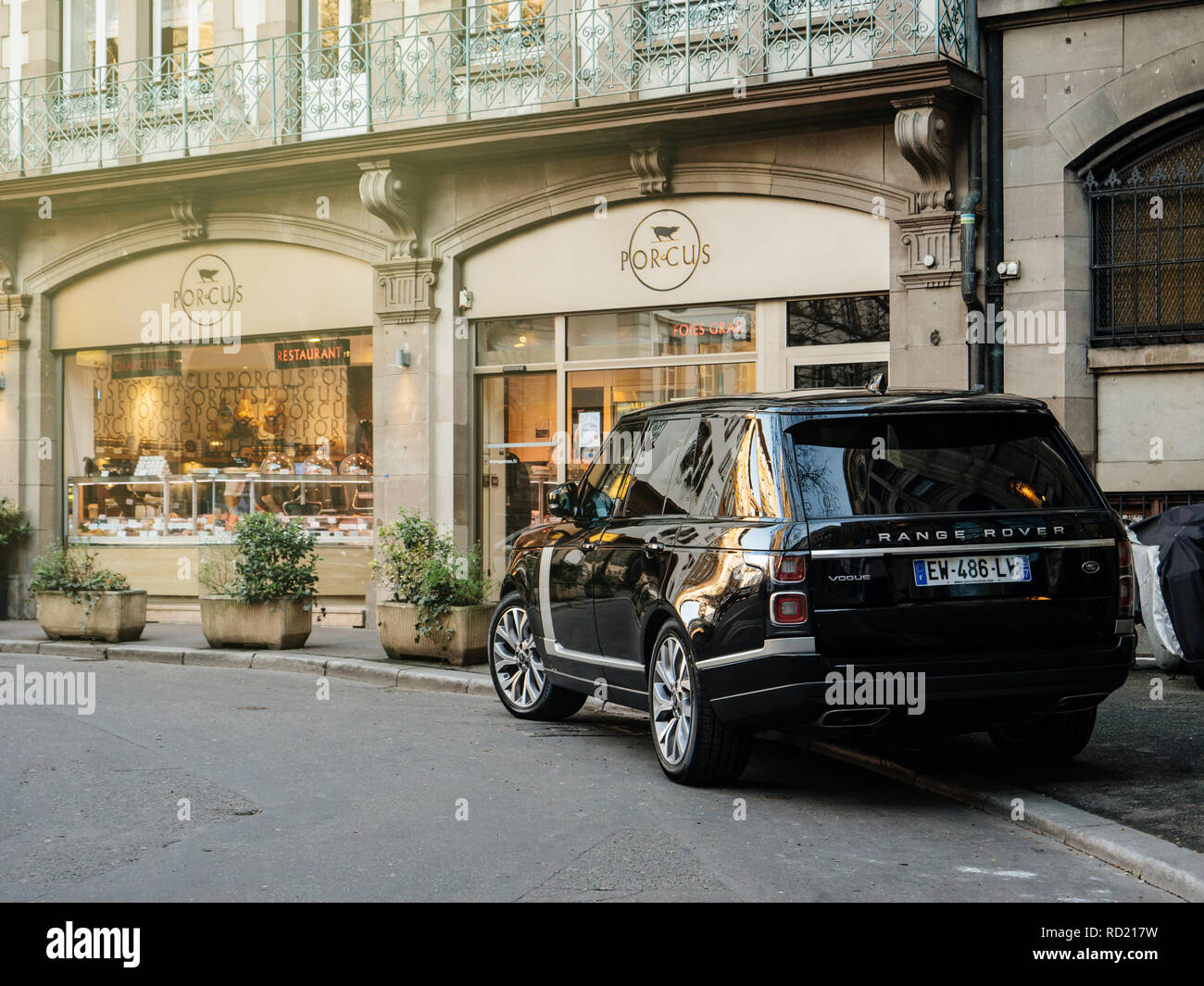 STRASBOURG, FRANCE - 13 MAR, 2018: New Range Rover Land Rover Vogue, the luxury British SUV parked in central French street near butcher shop Porcus Place du Temple Neuf  Stock Photo