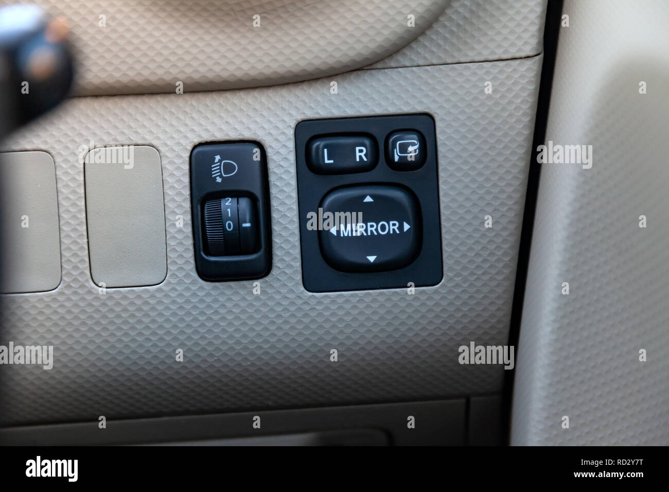 The buttons for controlling the mirrors electric drive on a stylish