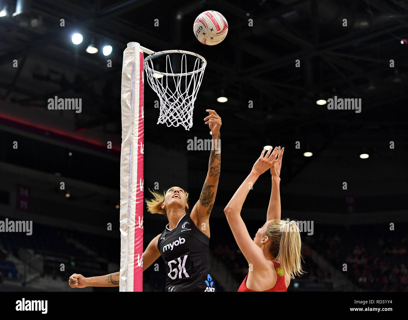 Silver Ferns' Erena Mikaere (left) and England Roses' Helen Housby ...