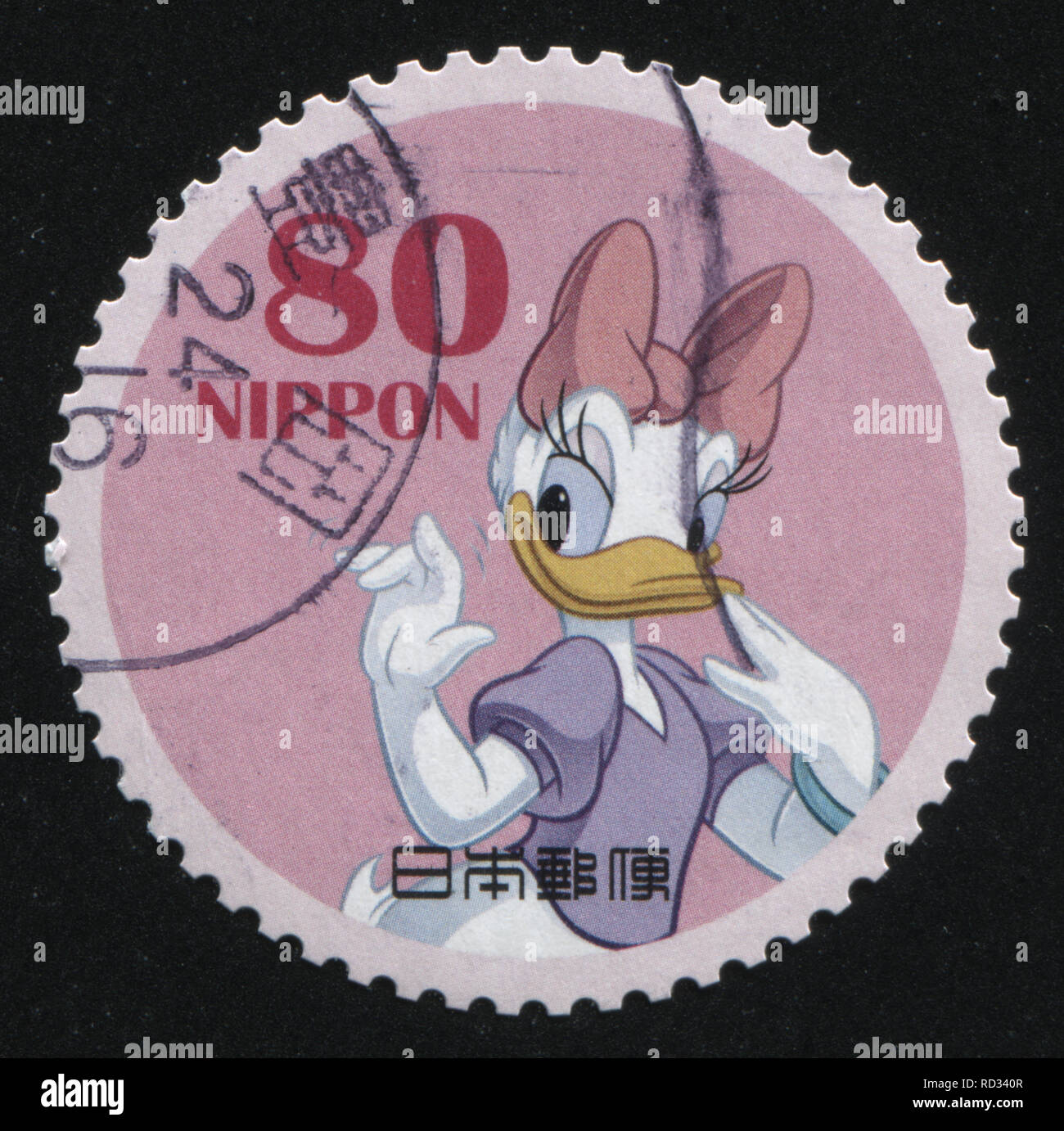 RUSSIA KALININGRAD, 22 APRIL 2016: stamp printed by Japan, shows Daisy Duck waving with her hand, circa 2011 Stock Photo