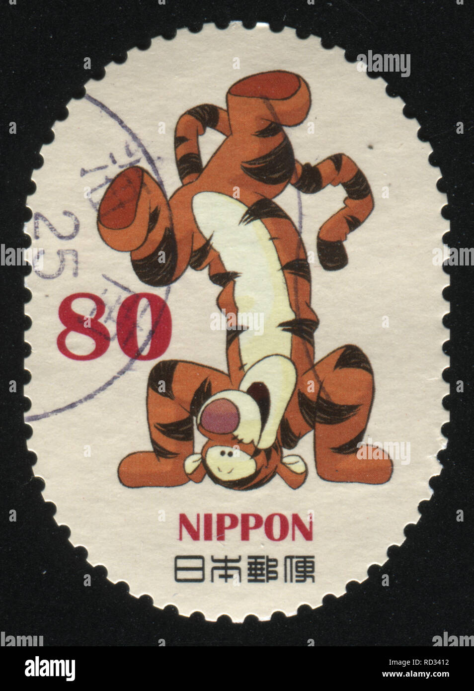 RUSSIA KALININGRAD, 22 APRIL 2016: stamp printed by Japan, shows tiger standing upside down, circa 2011 Stock Photo