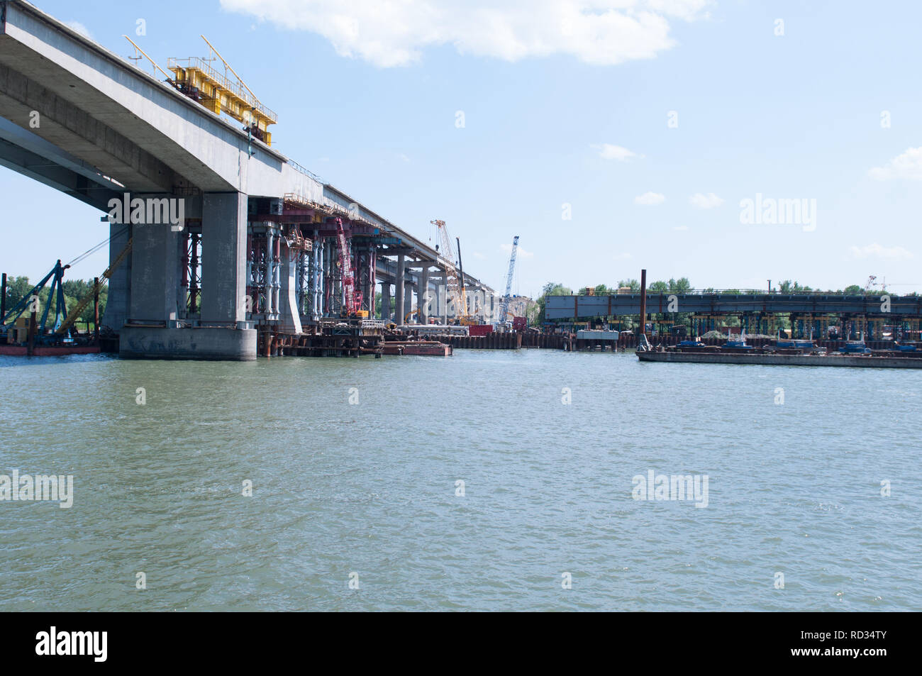 Construction of a bridge across the river. Stock Photo