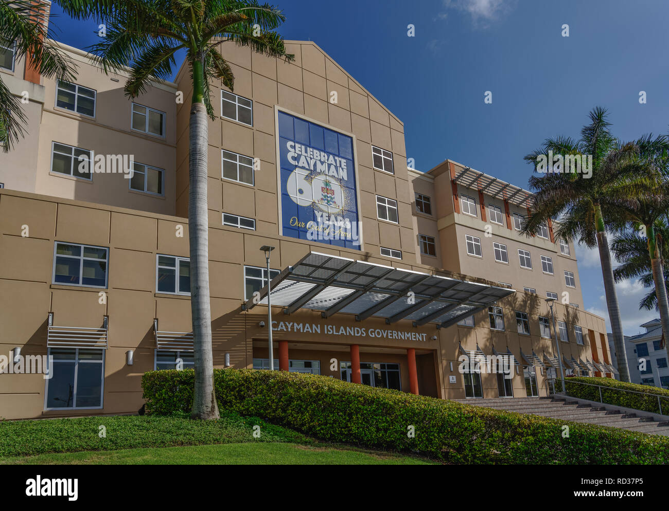 Cayman Islands Government building in George Town with Celebrate Cayman 60 Years Our Coat of Arms banner Stock Photo
