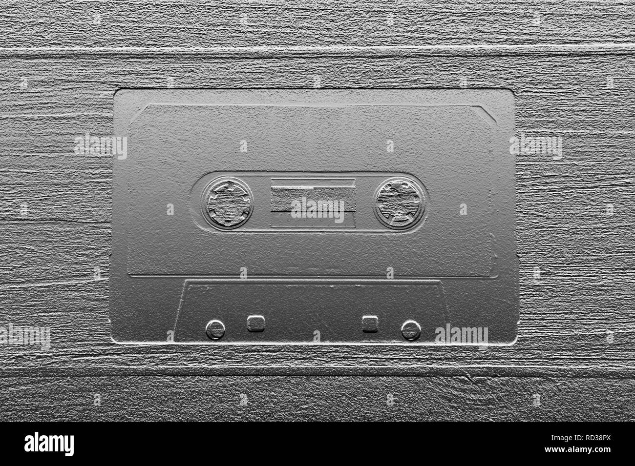 Old tapes cassettes for recording on stylized background Stock Photo