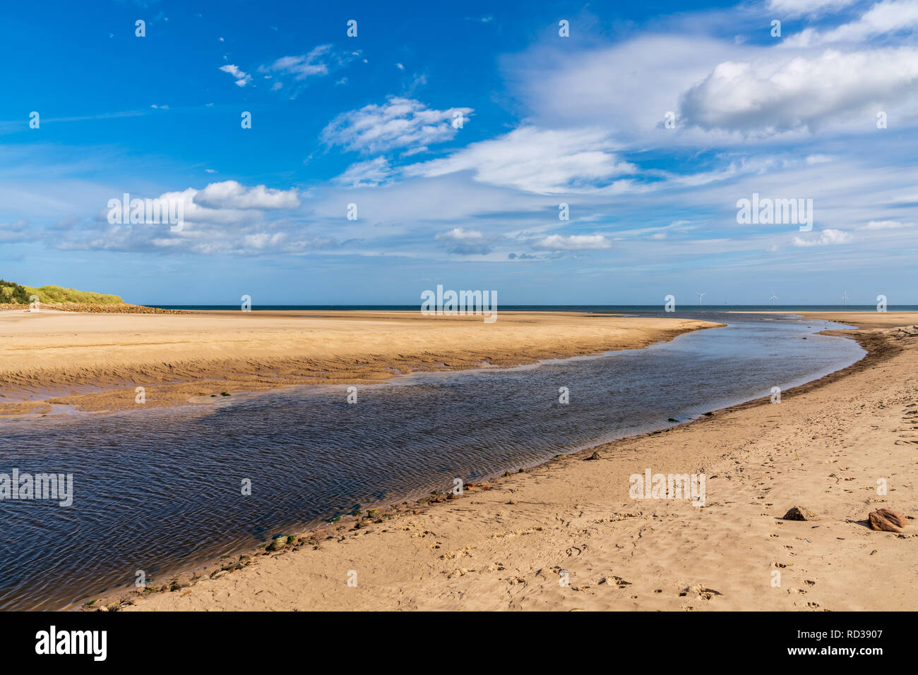 The River Wansbeck flowing into the North Sea in Cambois, Northumberland, England, UK Stock Photo