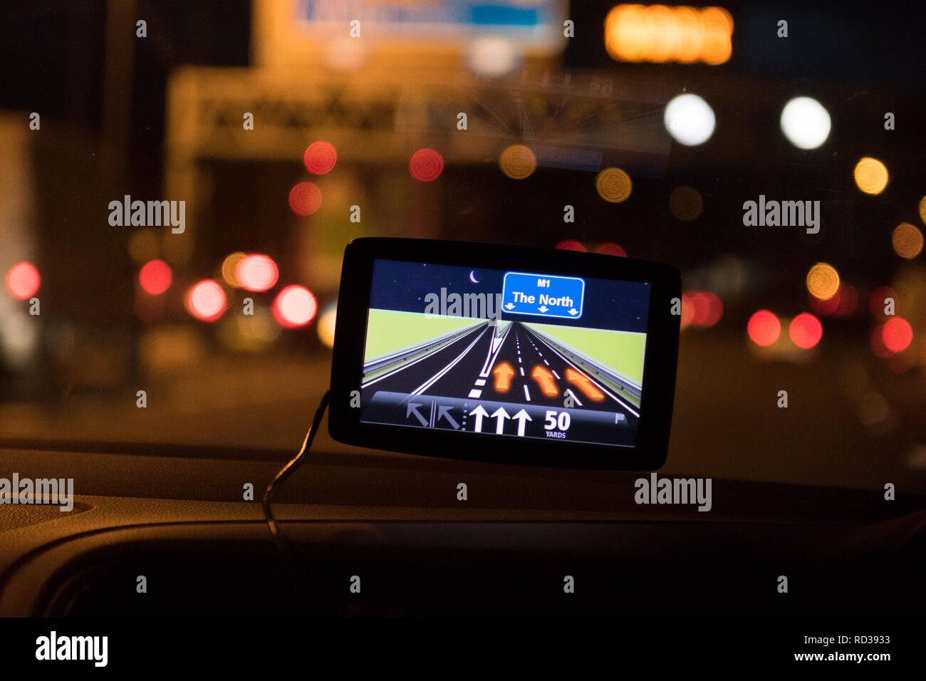 North of England concept - car sat nav showing M1 North in car heading north on M1 motorway at night Stock Photo