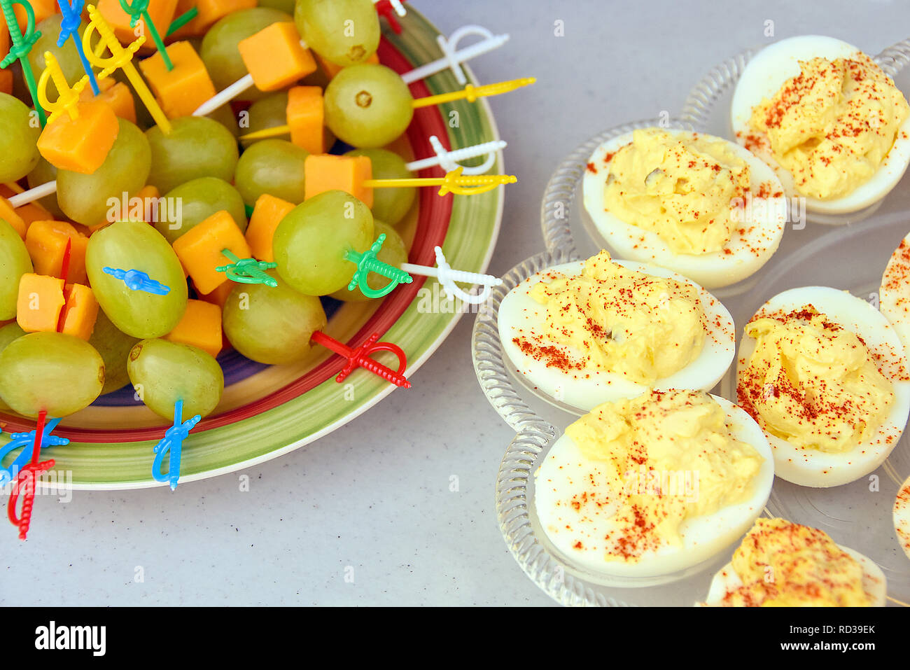 deviled eggs with green grape and cheddar cheese appetizer on table