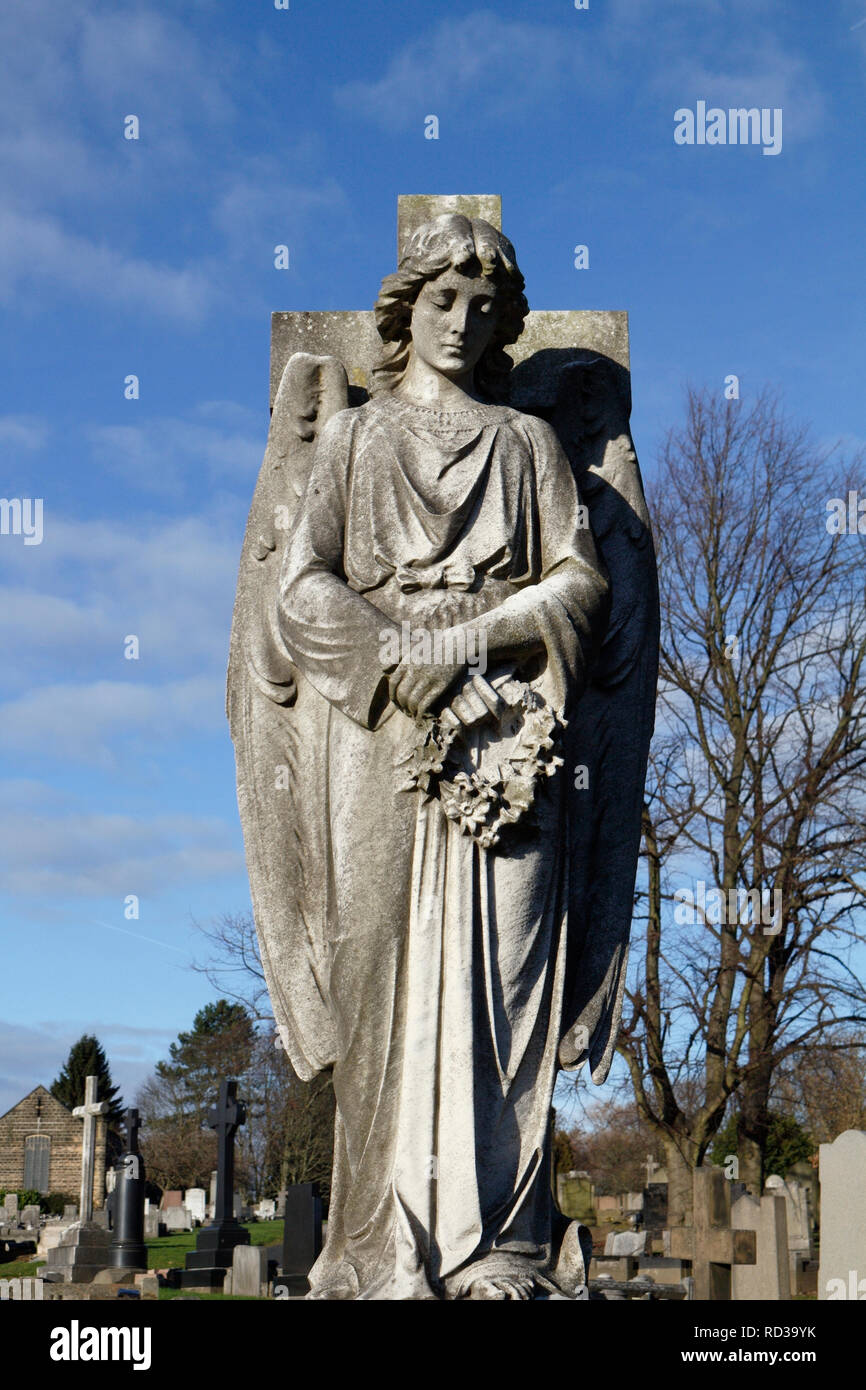 cemetery angel statue sculpture on a grave Stock Photo
