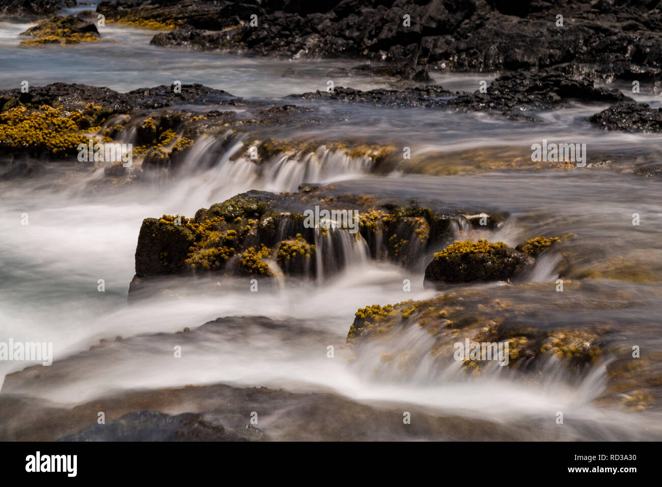 Tide pools time exposure of the pulsating ocean Stock Photo