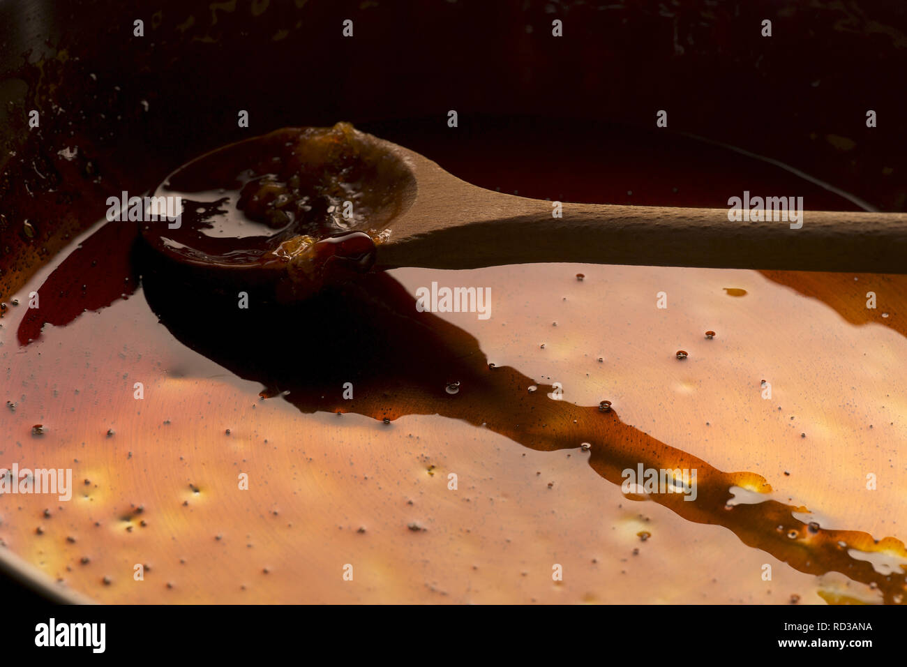 Close up of frying pan of used oil, studio shot Stock Photo