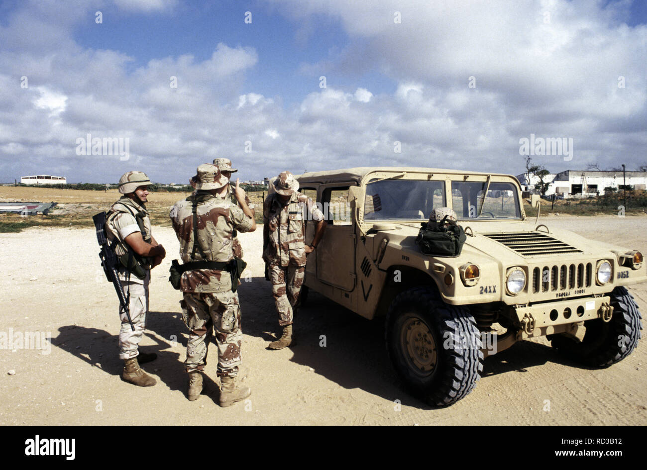 12th October 1993 A group of U.S. Army soldiers stand next to a Humvee in the UNOSOM headquarters compound in Mogadishu, Somalia. Stock Photo