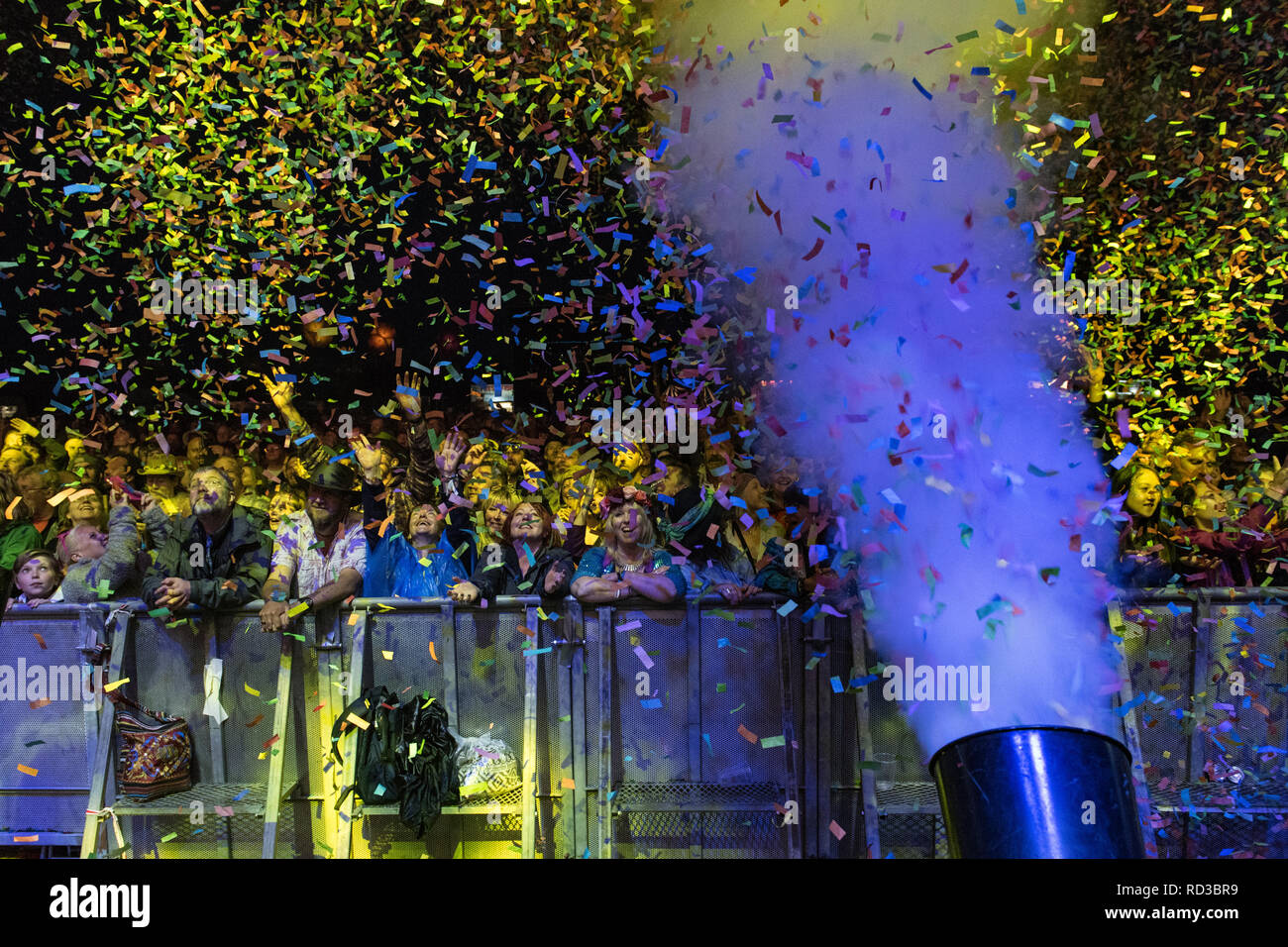 Confetti cannons throwing confetti onto the crowd at a music festival