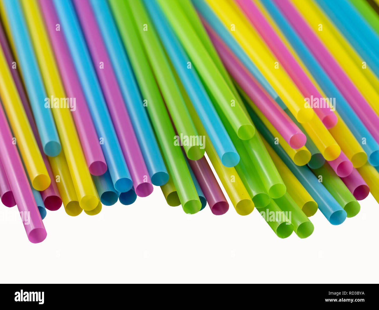 Coloured straws, bundles on a white background Stock Photo - Alamy