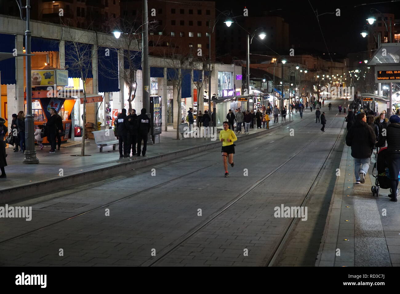 JERUSALEM - JANUARY 2019:  Jaffa Street in central Jerusalem is free of cars and pedestrians make use of it after the tram has gone by. Stock Photo