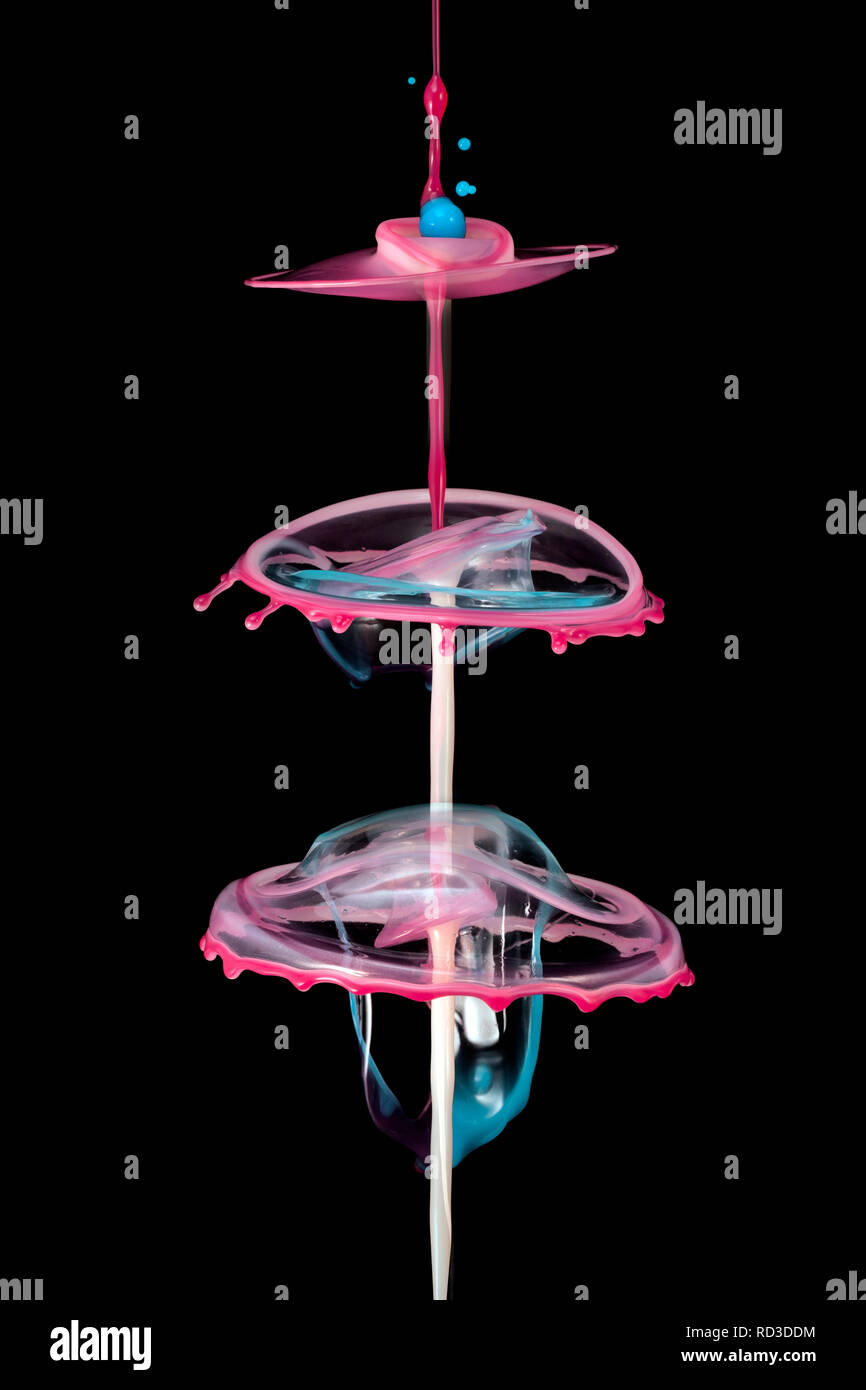 Pink water splash against a black background Stock Photo Alamy